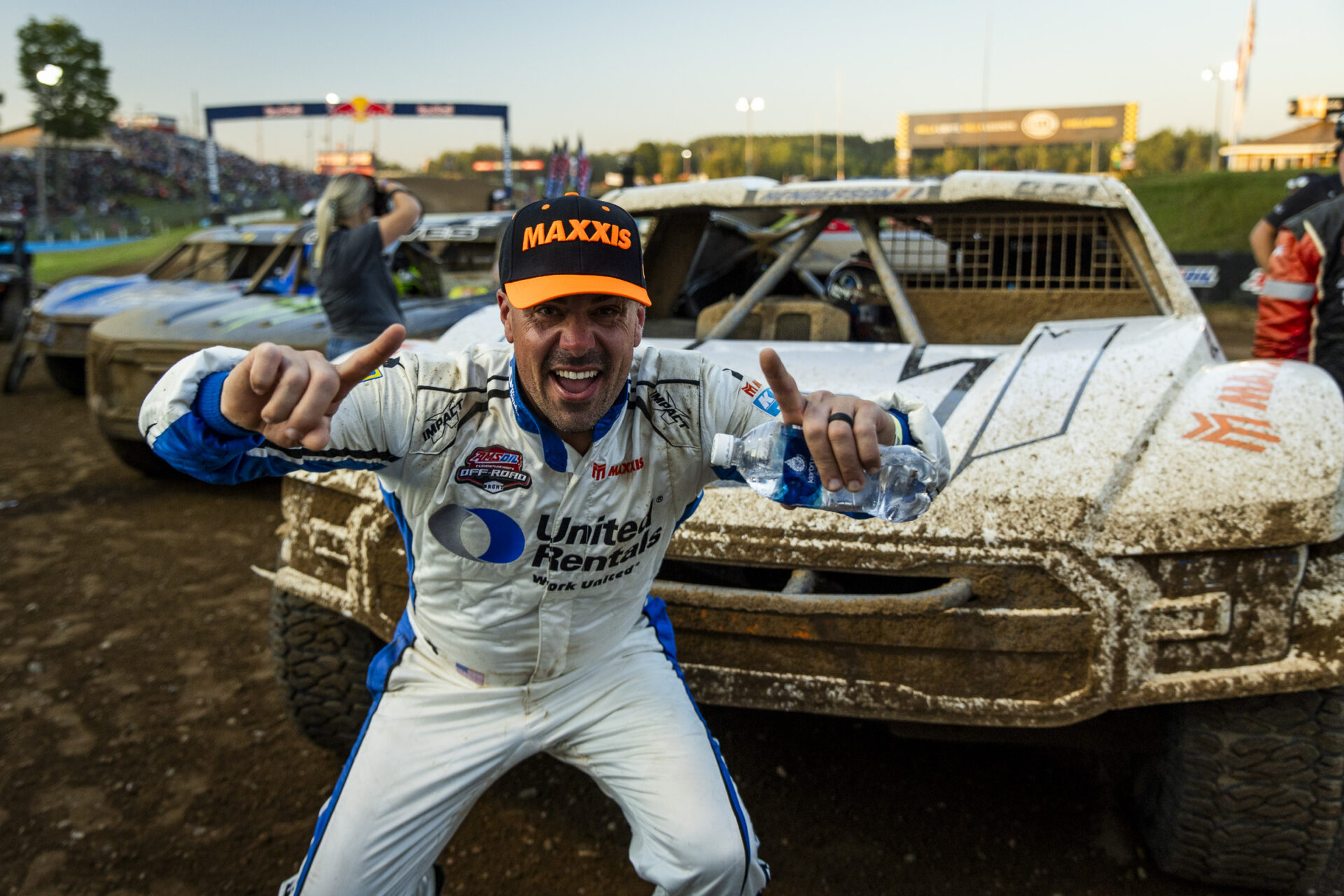 maxxis athlete holding up two fingers after a win