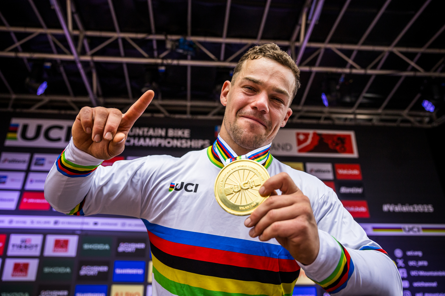 Richie ride in World Champion Jersey holding medal