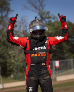 racer celebrating holding up #1