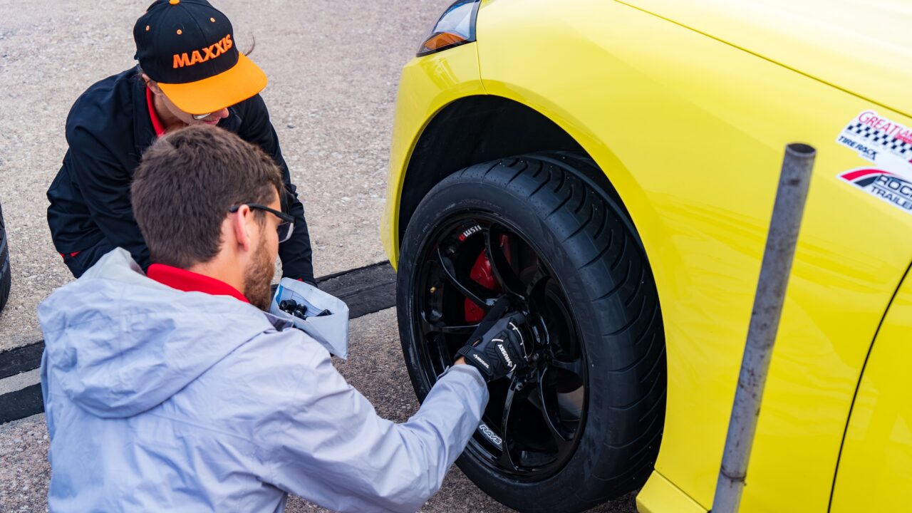 Mechanic inspecting a tire.