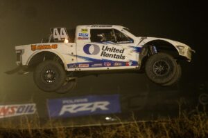 Jimmy Hendersons car getting some air on course