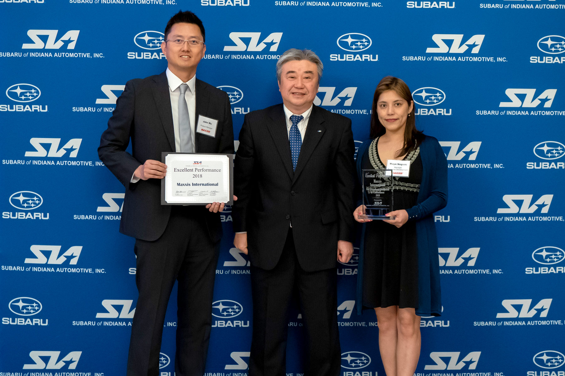 Award Photo (L-R): John Wu (Maxxis International, Product Manager), Eiji Ogino (Subaru of Indiana Automotive, Inc. (SIA), President and CEO), Maya Negishi (Maxxis International, Business Development Manager).