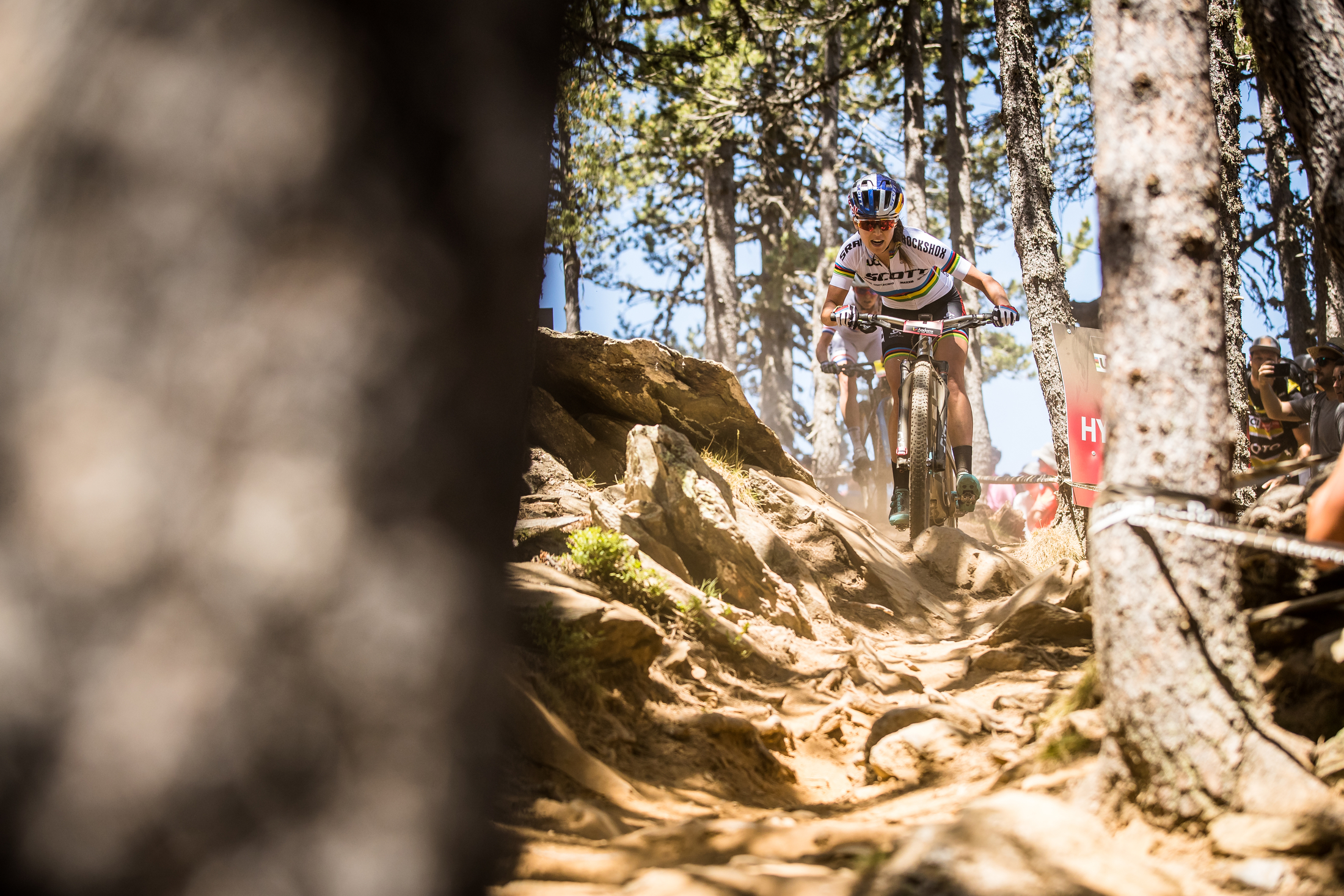 Kate Courtney weaves through a technical chute.
