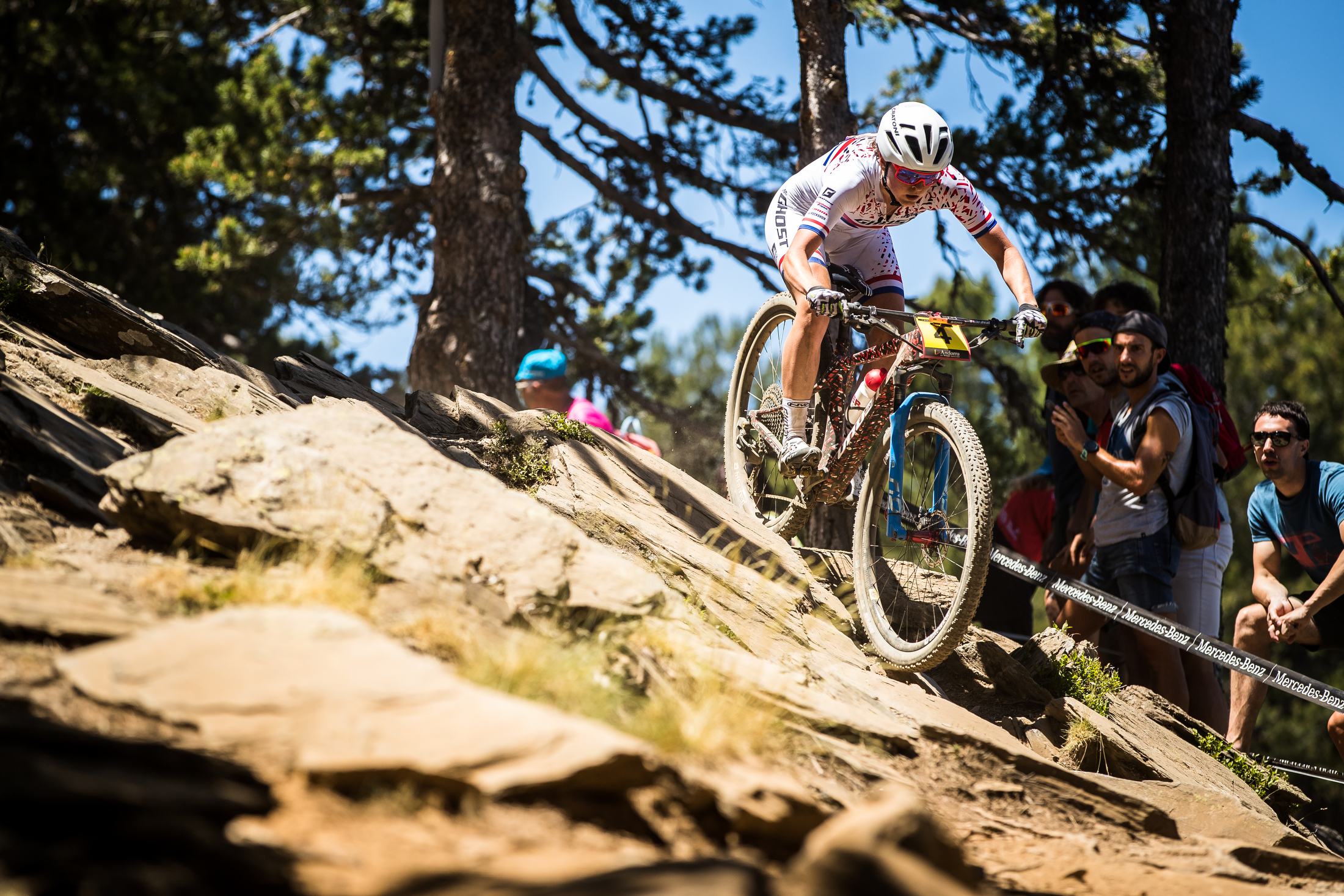 Anne Terpstra stays light on the bike over some slab rocks.
