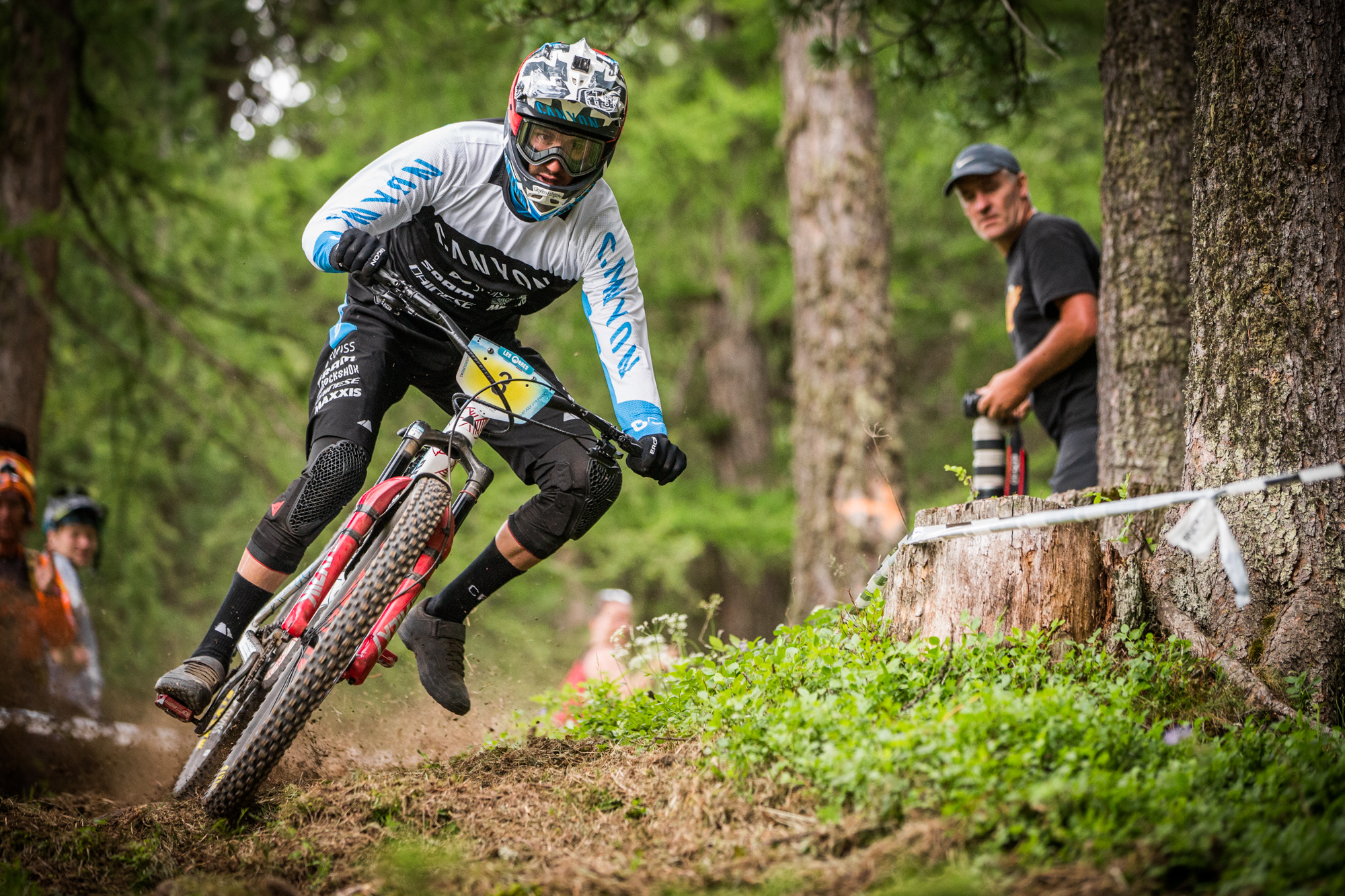 Florian Nicolai picks one foot off of the pedal to correctly weight his bike through an off-camber.