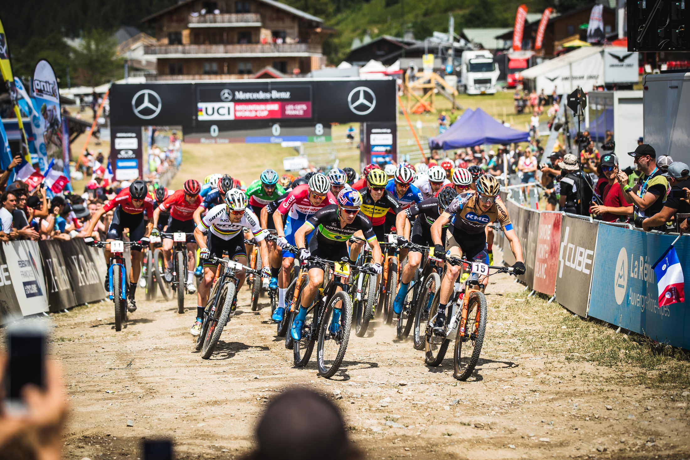 The Elite Men charge off of the start line on to the course.