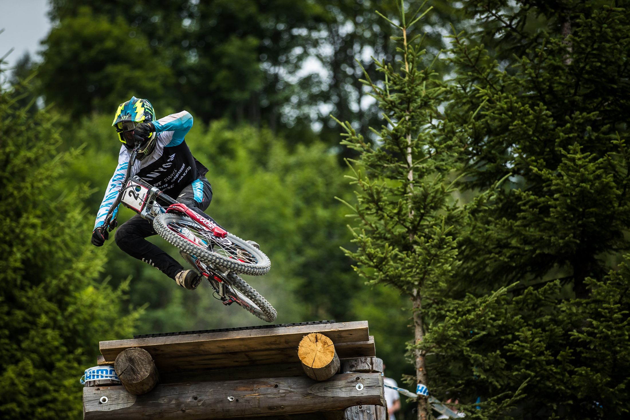 Troy Brosnan scrubs the bike off the lip of a ladder drop.