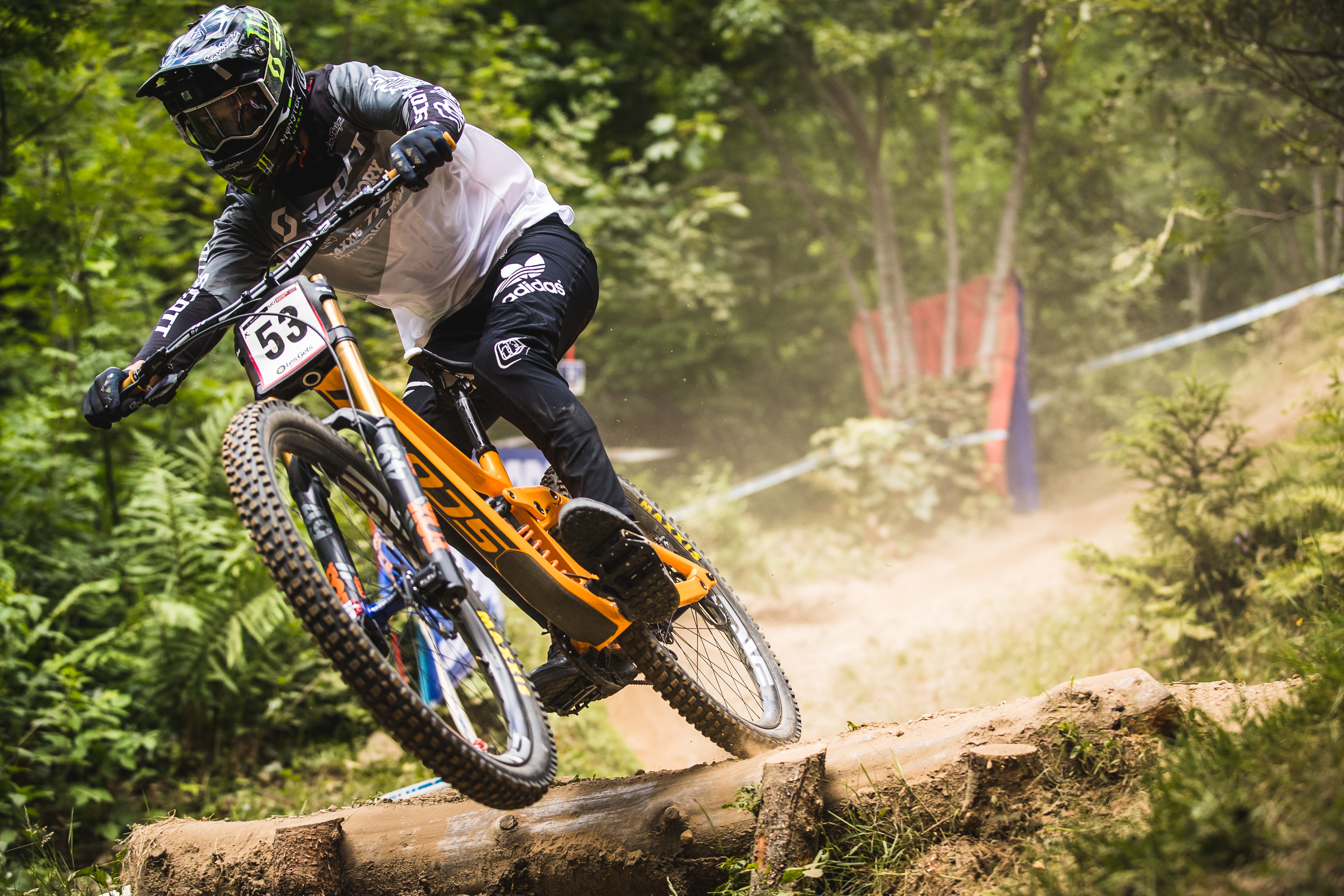 Brendan Fairclough carries speed over a log drop.