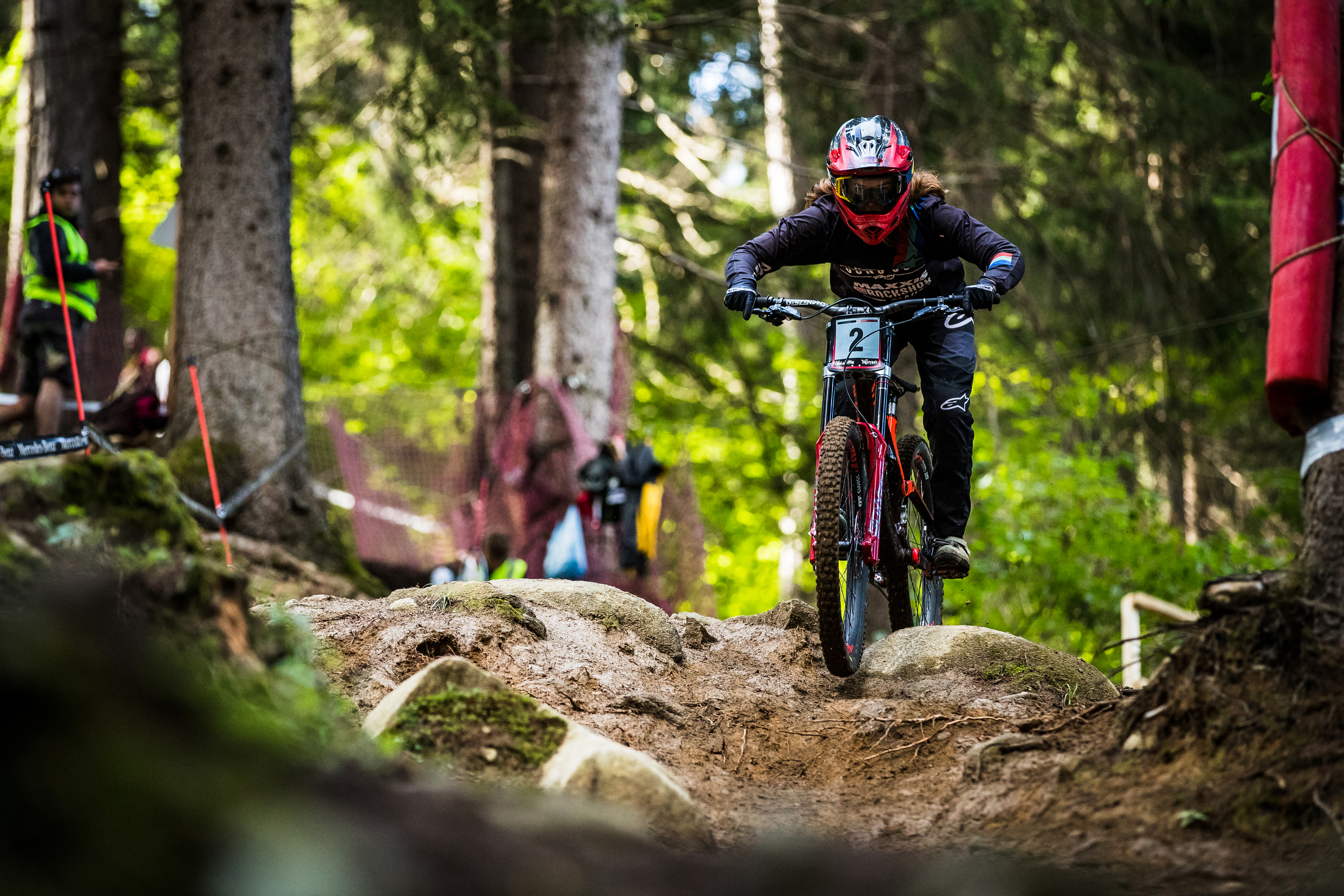Anna Newkirk keeps it straight over a rocky rise in the woods.