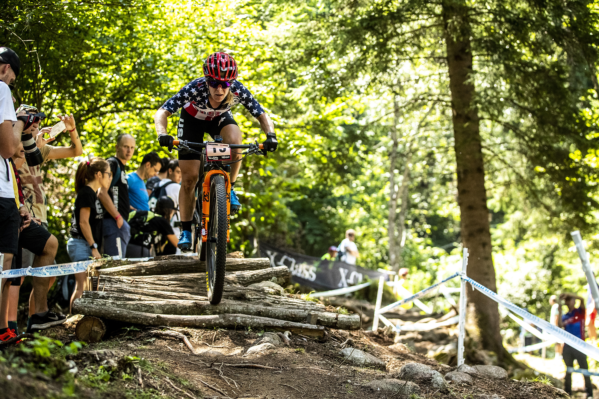 Chloe Woodruff rides over a strategically placed pile of branches