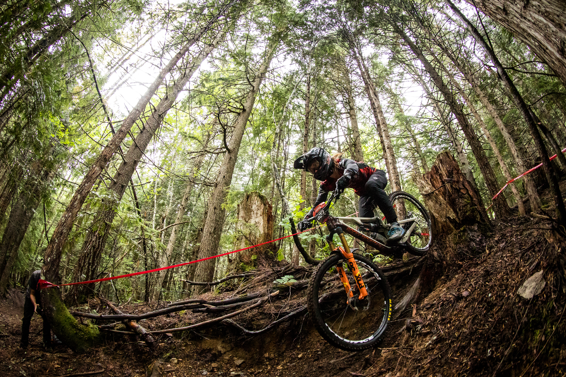 Andreane Lanthier Nadeau sits over the rear wheel in a steep section.
