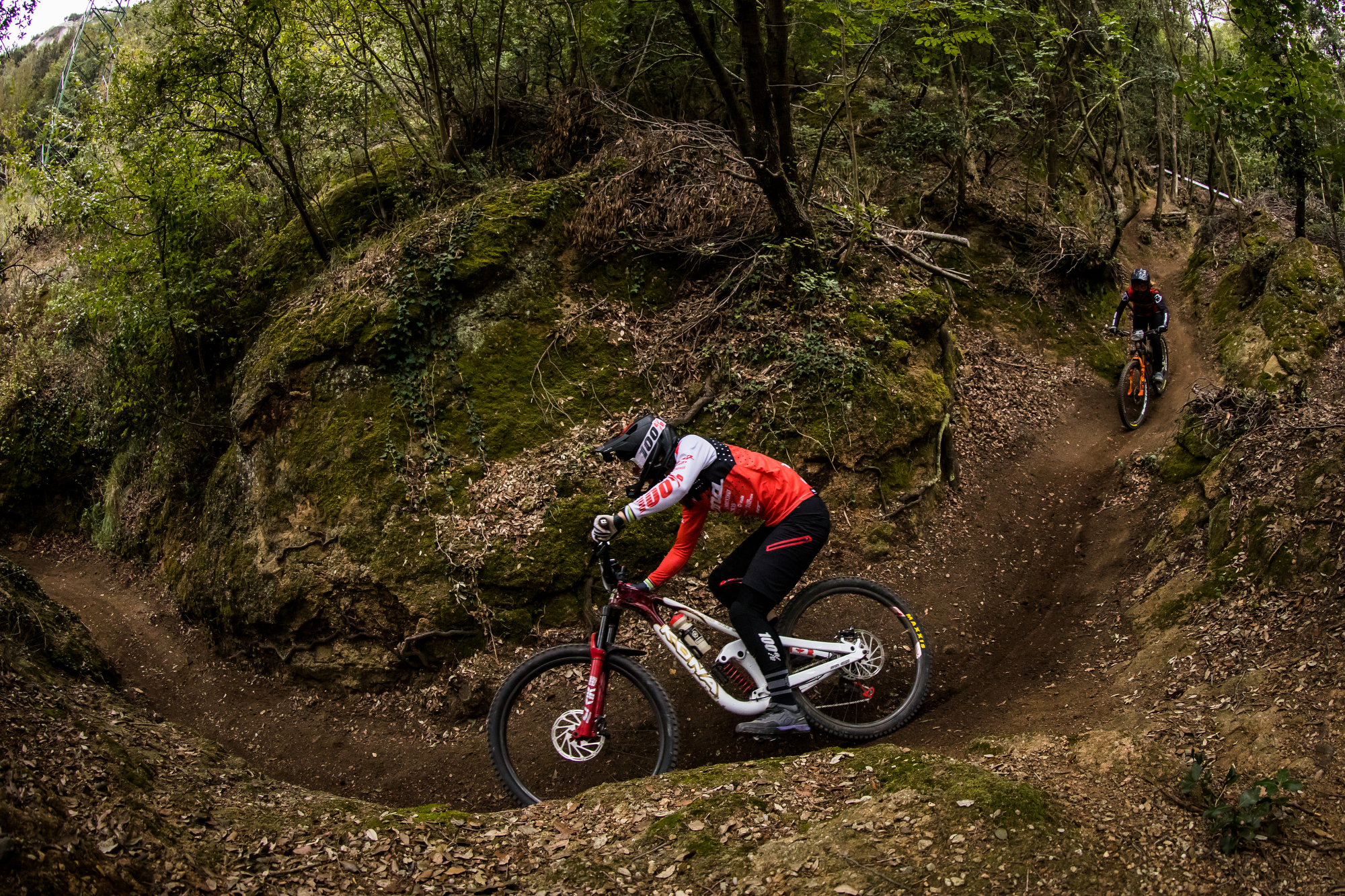 Miranda Miller leads Andreane Lanthier Nadeau through the woods of Finale Ligure.