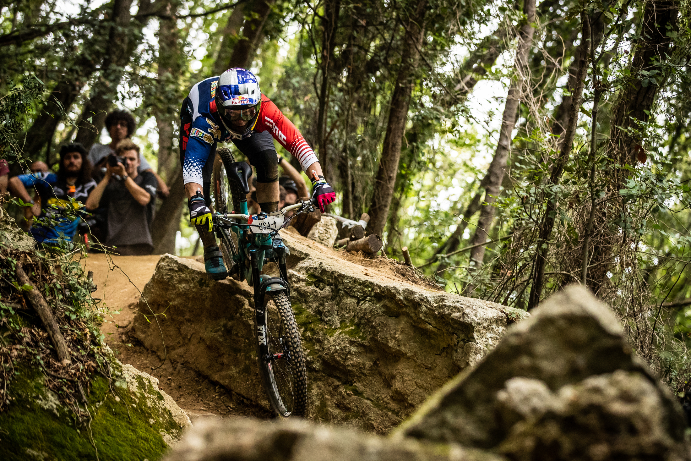 Richie Rude charges over a rock, nose down.