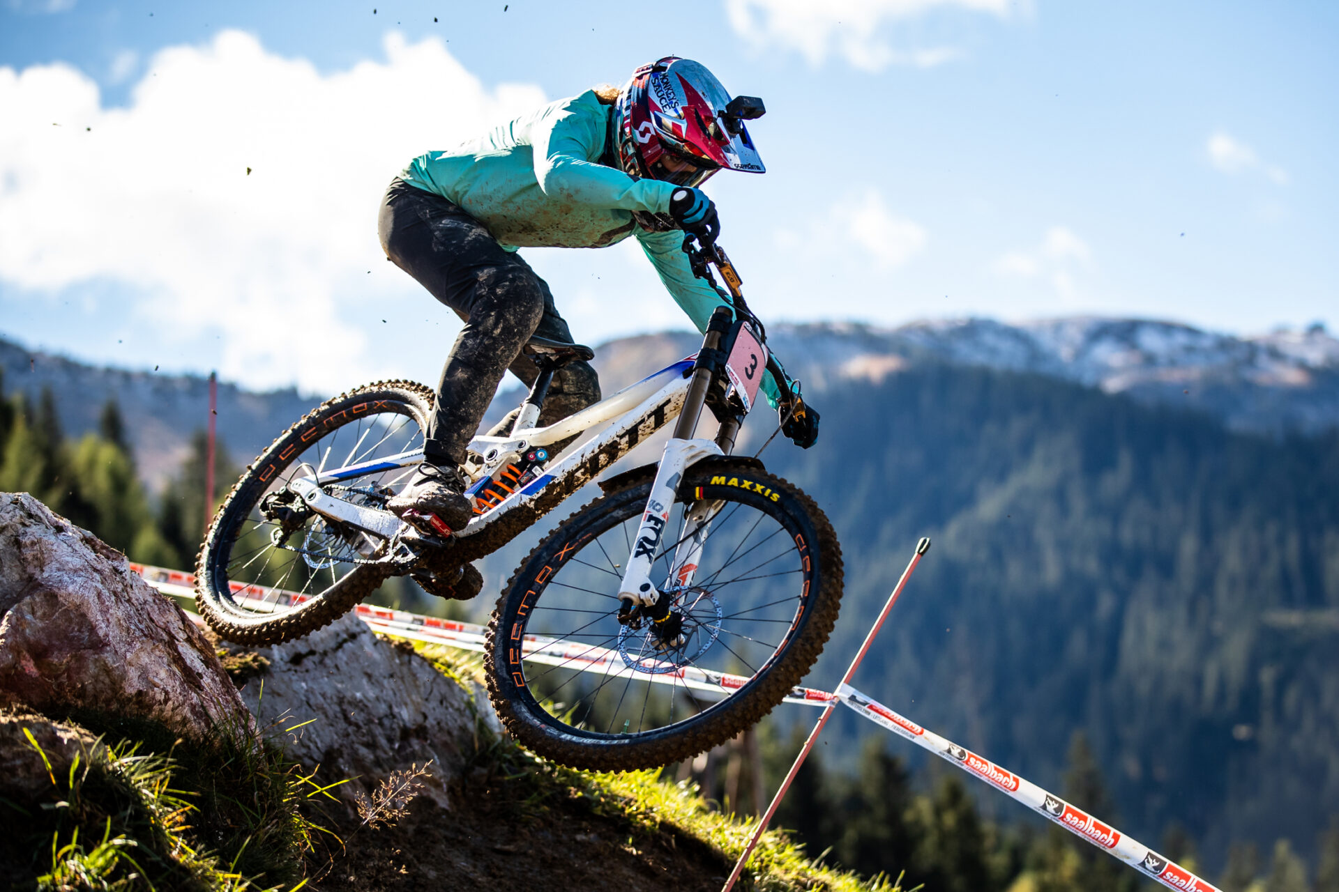 Scott DH rider jumping off rocks