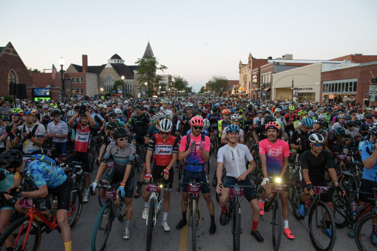 Large group of gravel riders at a start line