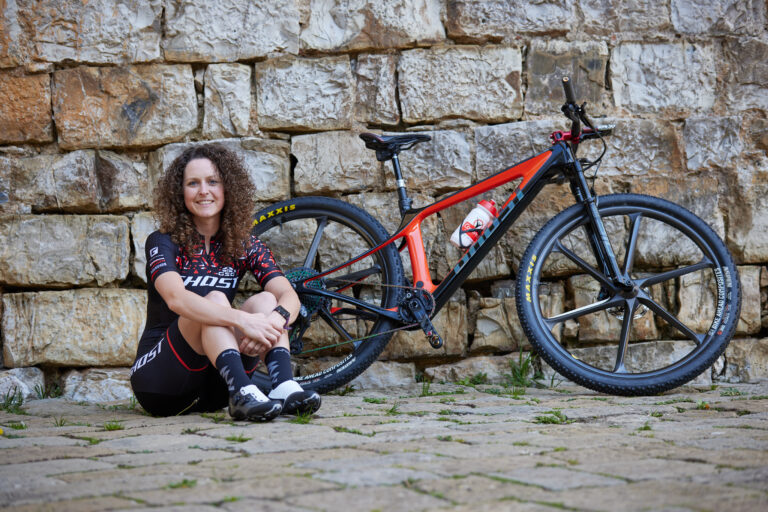 Ghost team member posing with bike