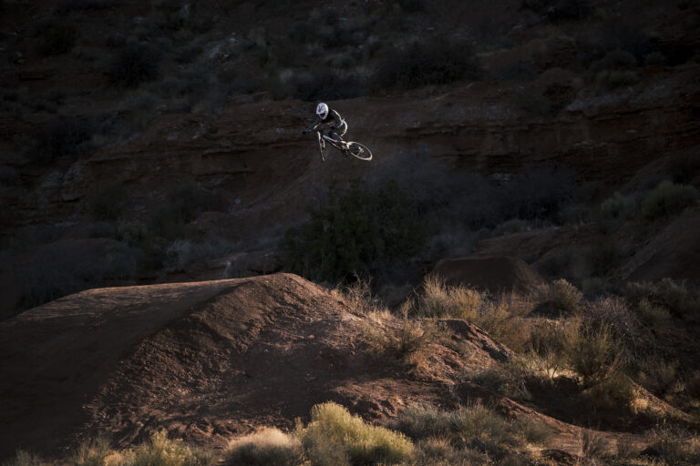 Bas jumping on his DH bike