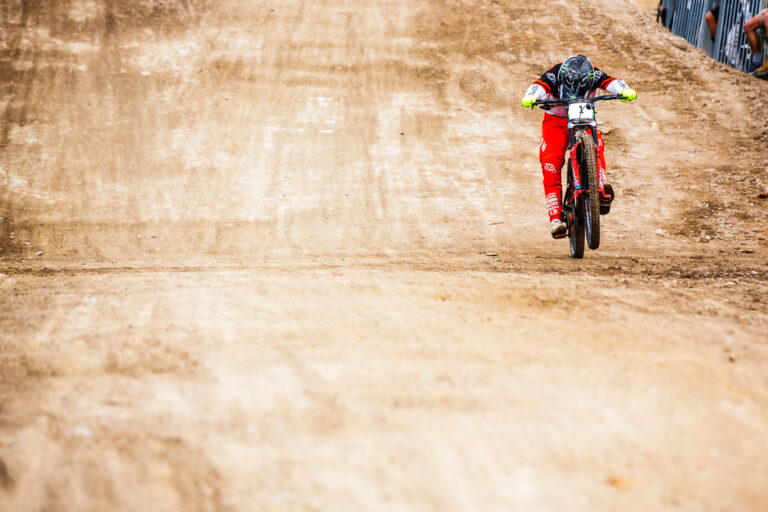 Canyon team member crossing the finish line