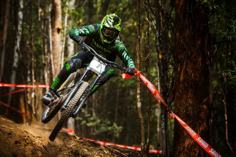 Canyon team member sending it in the woods