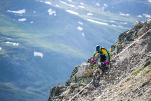 Richie Rude riding down a rocky stage