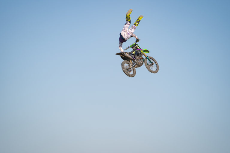 Axell Hodges mid air doing a freestyle trick.