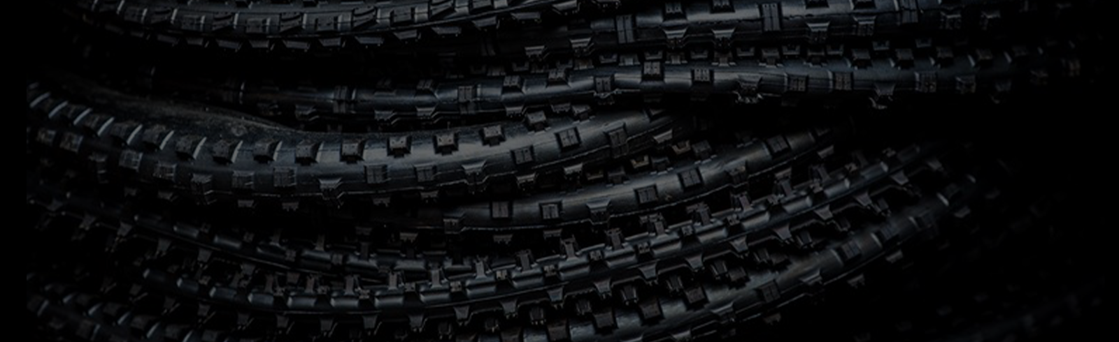 Stack of uninflated Maxxis bicycle tires