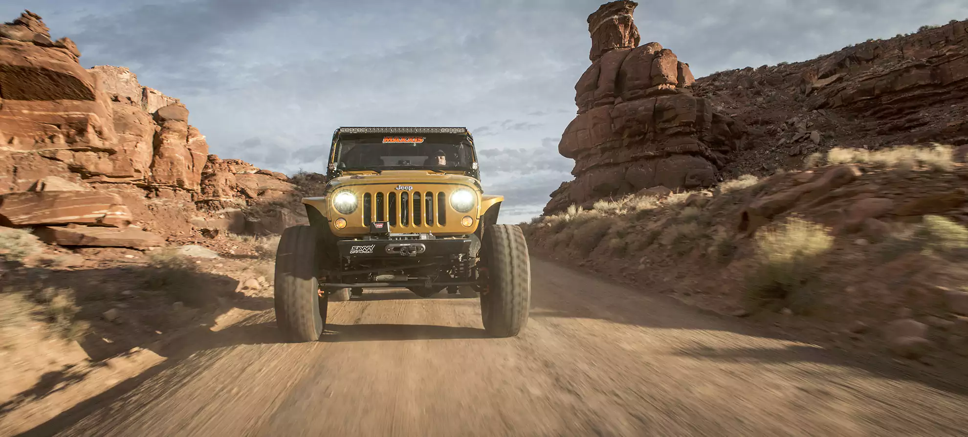 Yellow Jeep with Maxxis RAZR MT tires