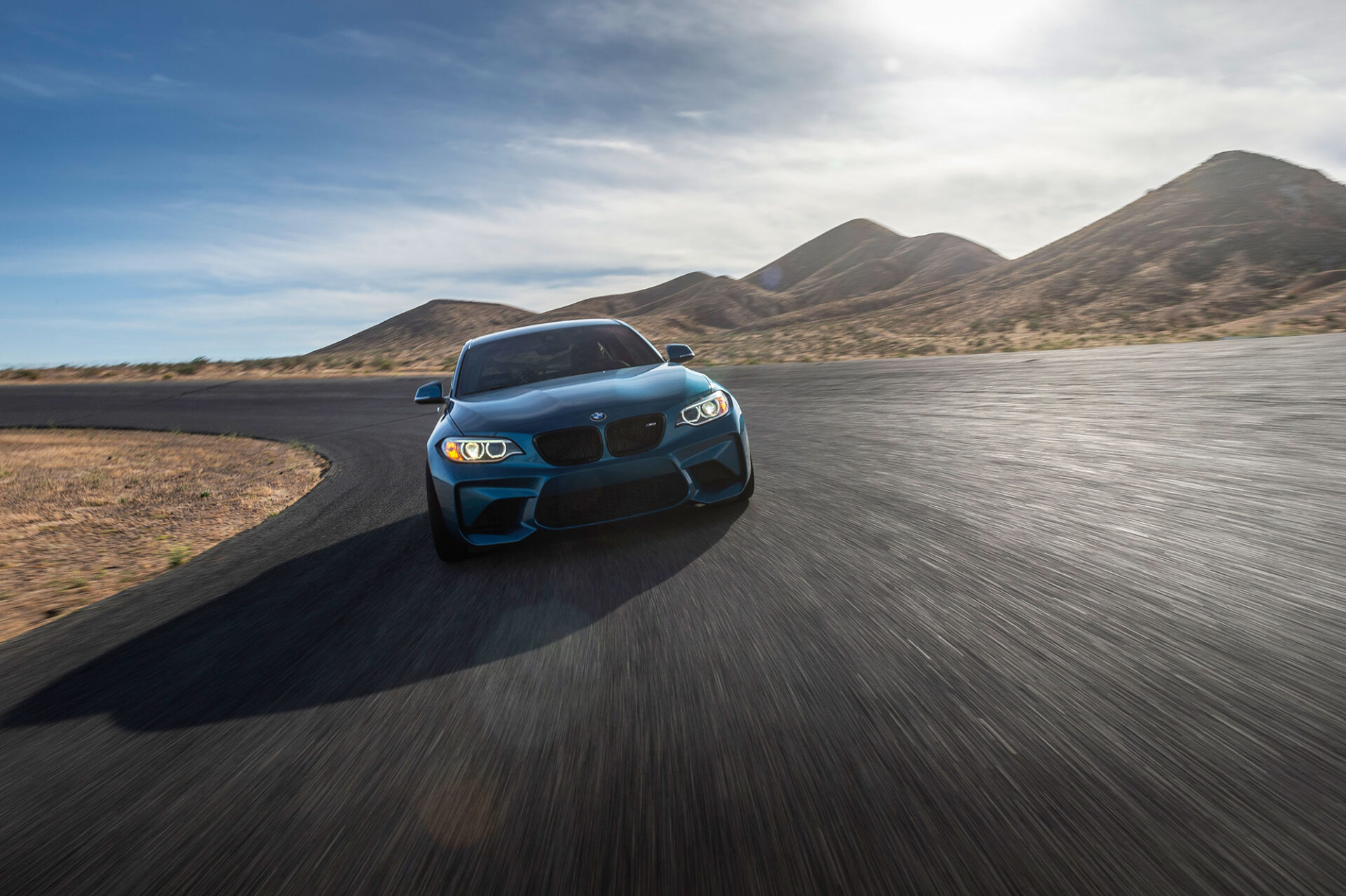 Car on desert road outfitted with Victra VR-1 tires.