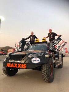 Coronel brothers with their vehicle.