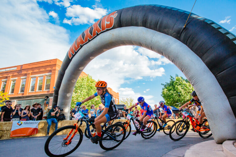 Racers going underneath Maxxis inflatable