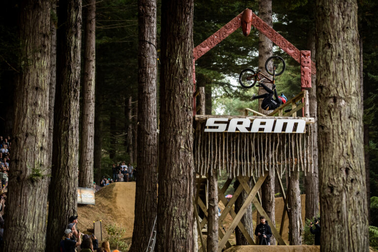 Rider dropping into the crankworx slope style course