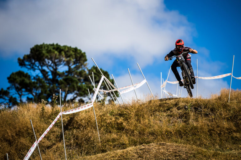 Rider sending it down grassy hill