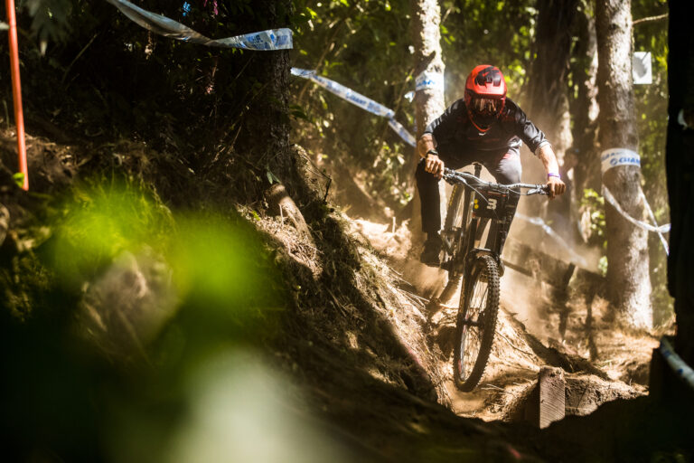 DH rider tackling a rock garden