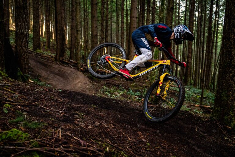 Reece hopping his rear wheel in the woods