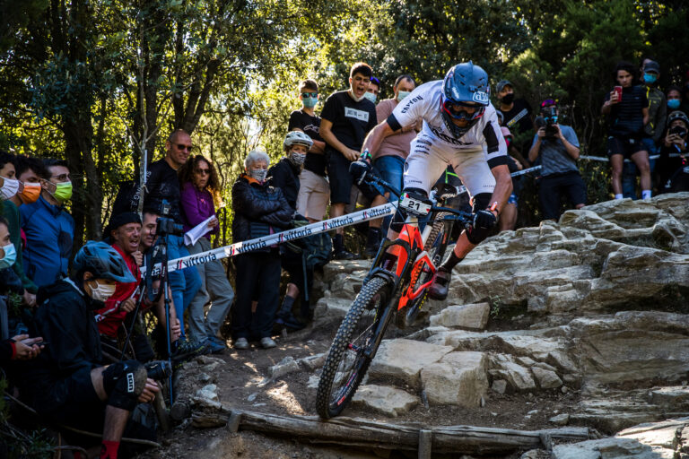 Canyon team member hitting a rock garden at the EWS