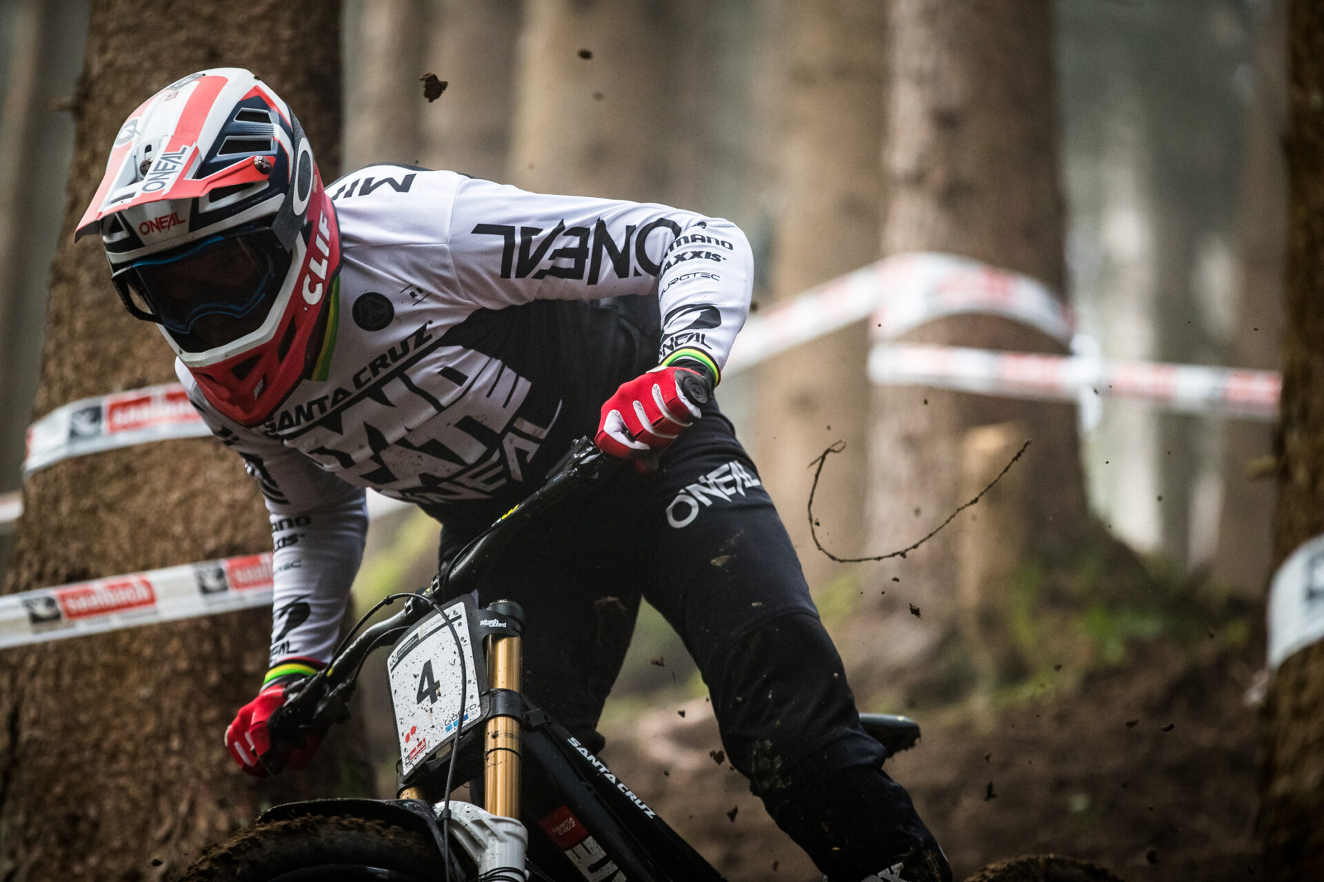 Santa Cruz rider shredding in a loamy forest