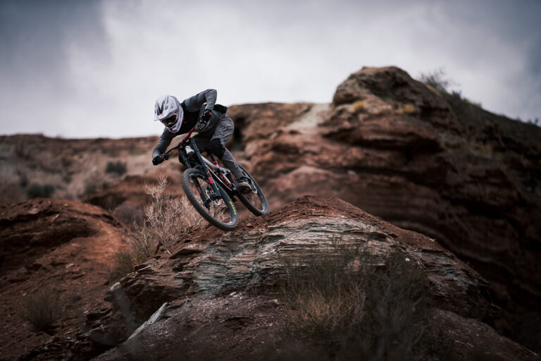 Bas at the top of a rock face