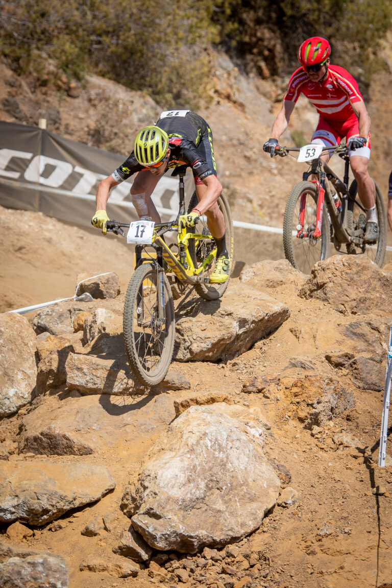 Scott racer riding down a rock garden