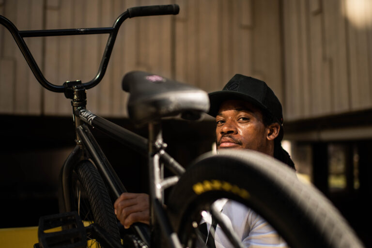 Simms holding his BMX bike