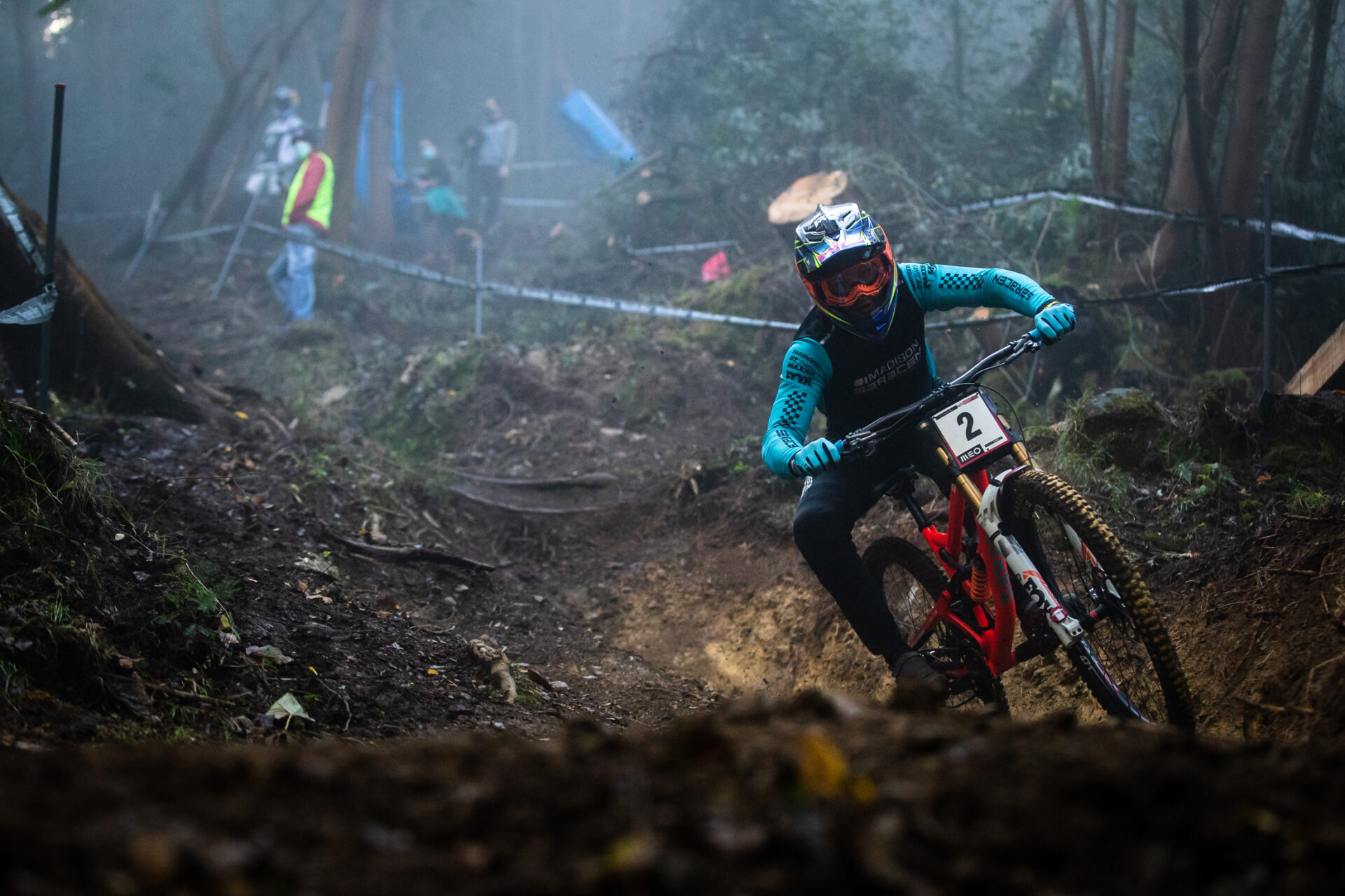 madison saracen team member riding in the damp weather