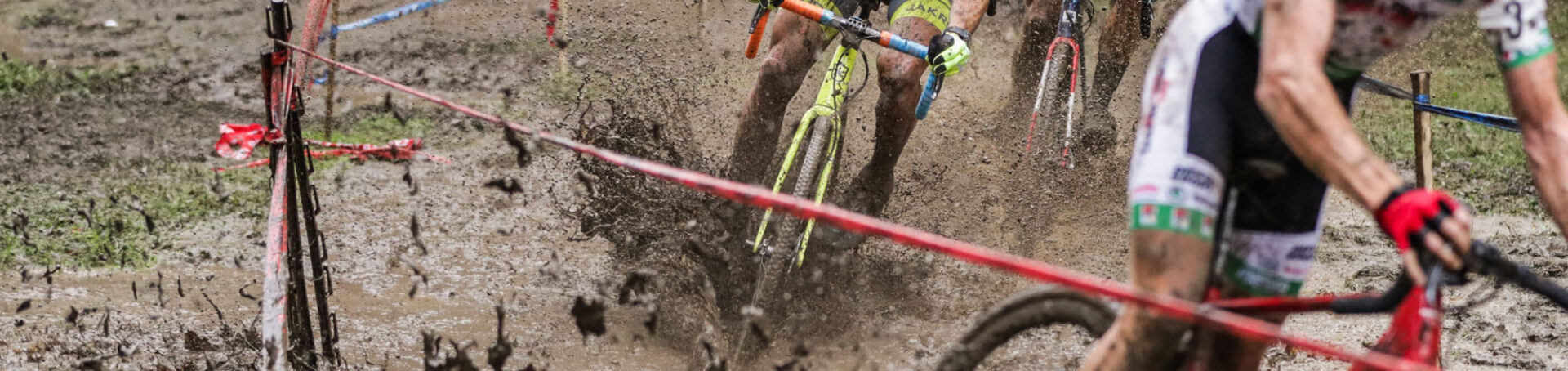 CX riders splashing through the mud
