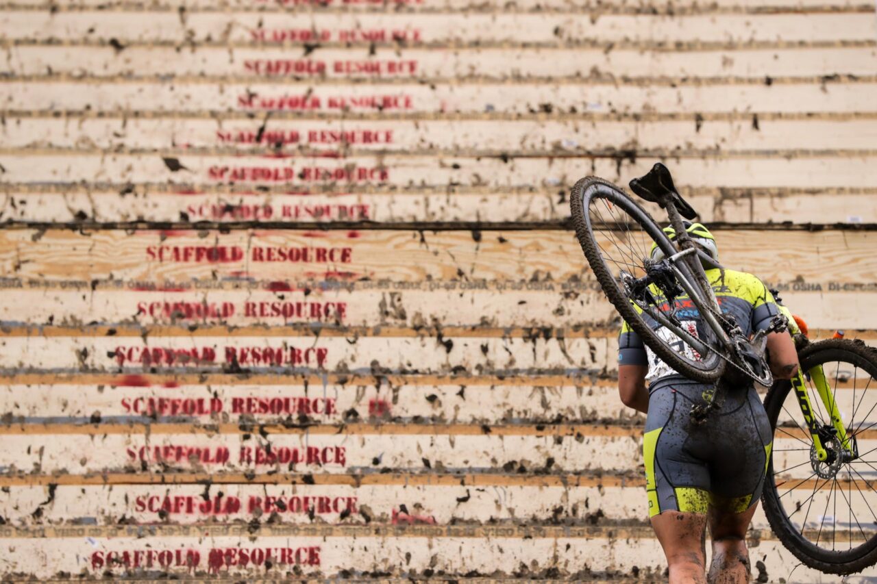 Kona CX racer running up stairs
