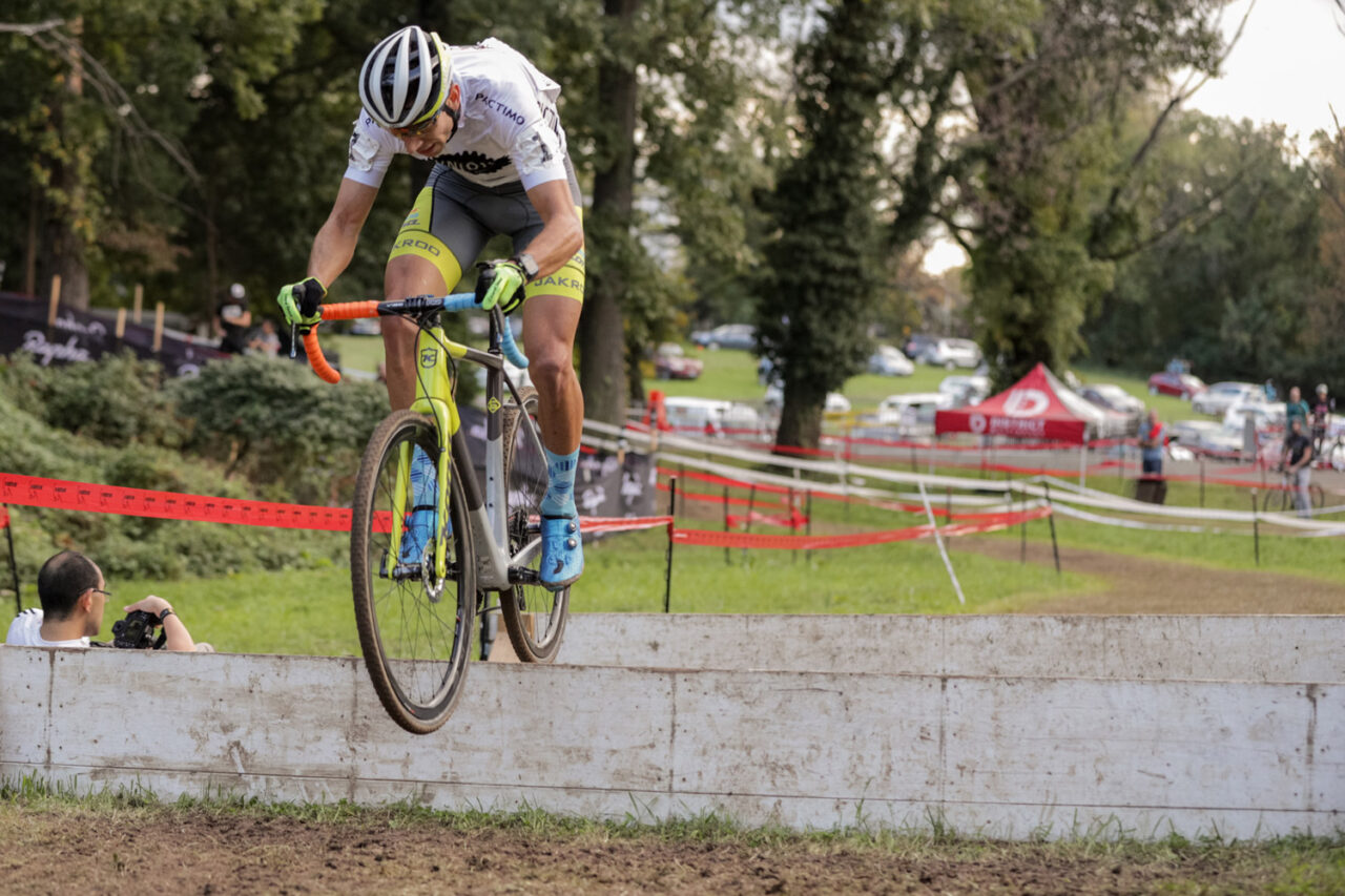 CX racer going over an obstacle