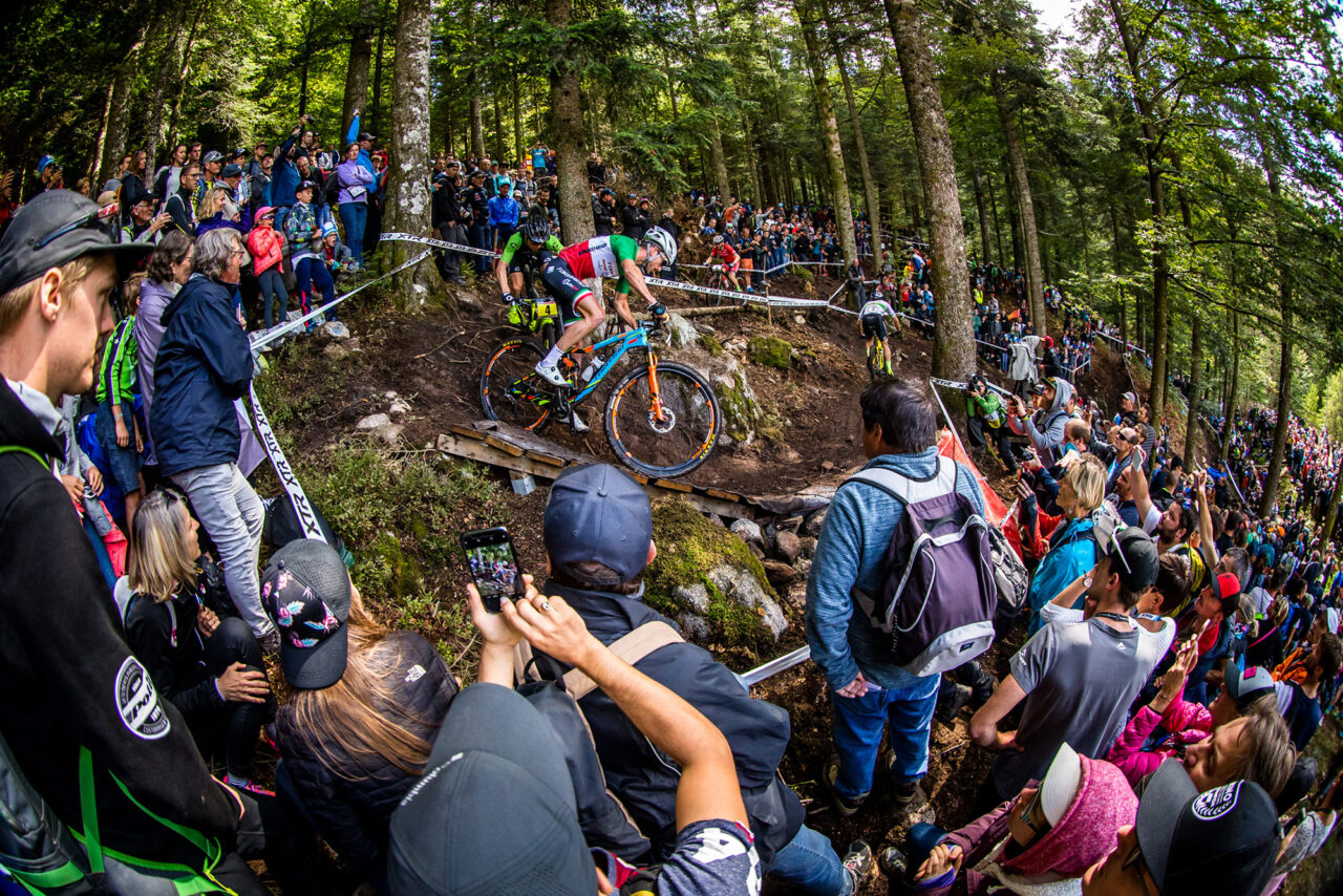 XC racers riding down a tight corner