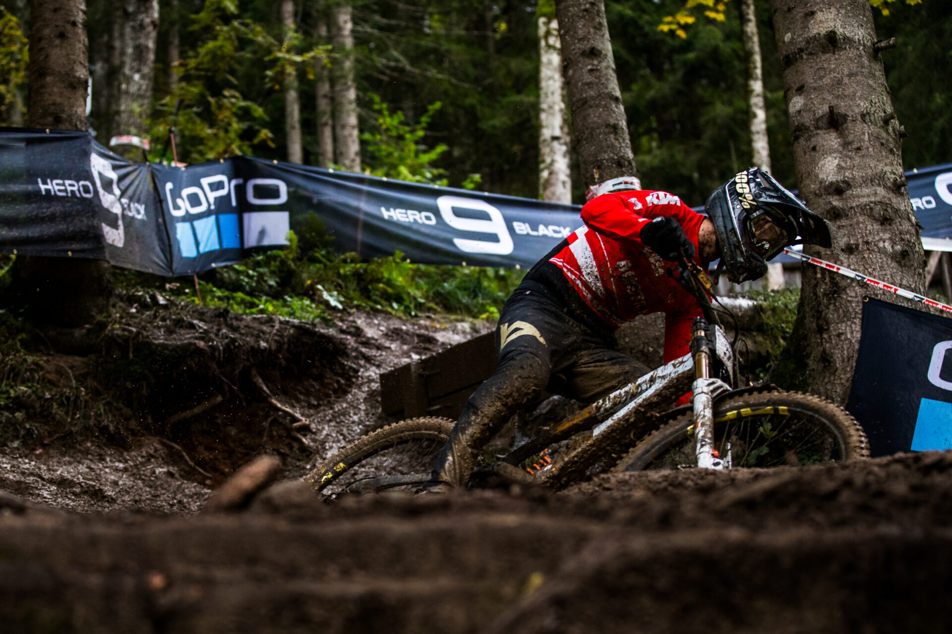 Rider descending down a muddy 2020 world champs course