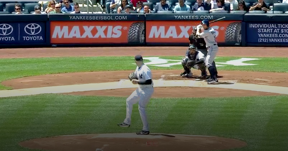 Maxxis banners behind home plate at New York Yankees game.