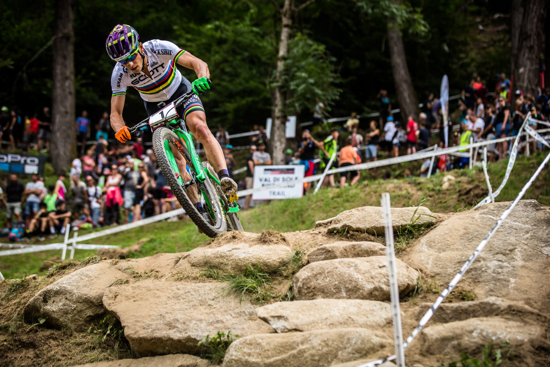 XC racer sending it down a rock garden