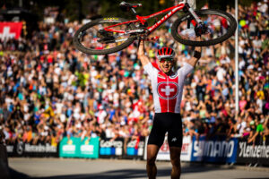 Nino raising his bike at the finish line