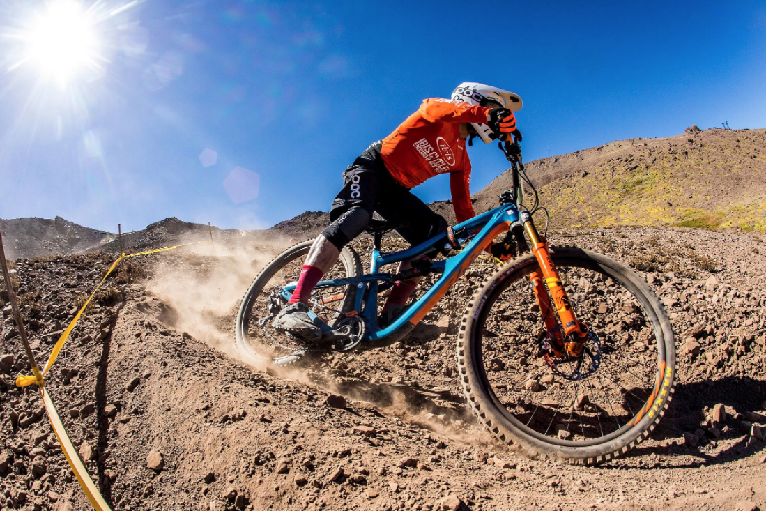 Ibis enduro racer sending a fast, dusty section