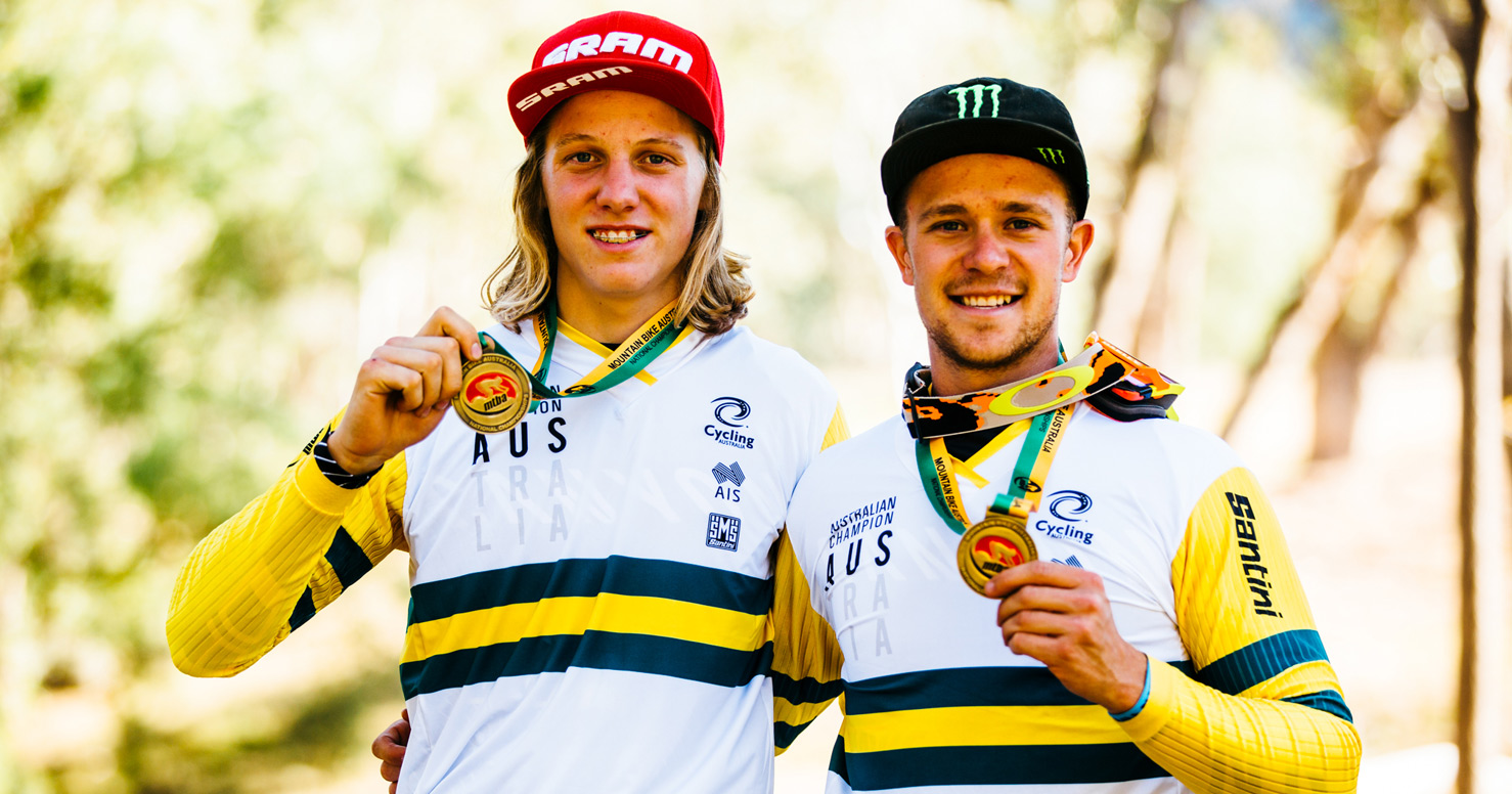 Troy poses with team mate with medals